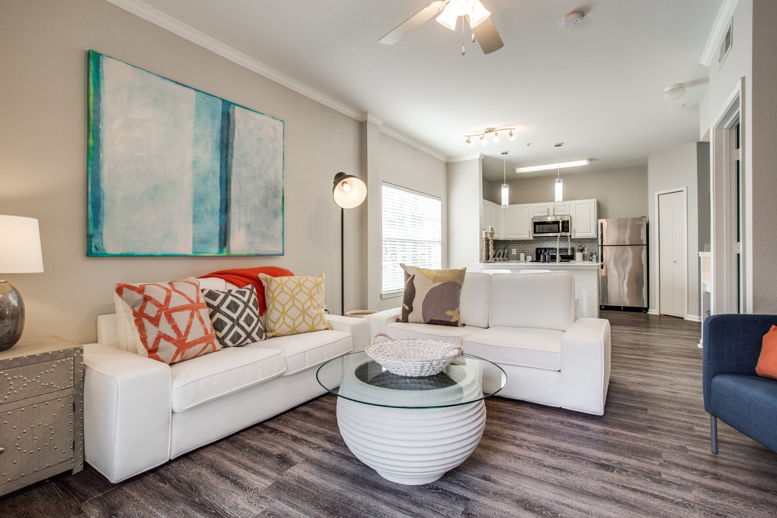 model living room with modern furniture and vinyl wood-look flooring